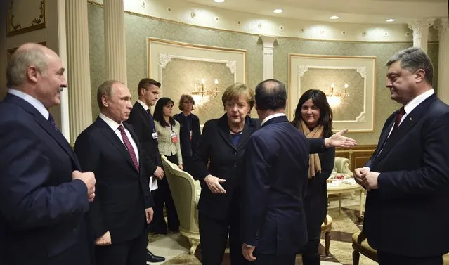 Russia's President Vladimir Putin (2nd L), Ukraine's President Petro Poroshenko (R), Germany's Chancellor Angela Merkel (4th R) and France's President Francois Hollande (3rd R) attend a meeting on resolving the Ukrainian crisis, with Belarus' President Alexander Lukashenko (L) seen nearby, in Minsk, February 11, 2015. (Photo by Mykola Lazarenko/Reuters)