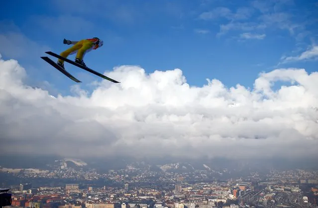 Peter Prevc of Slovenia soars through the air during a trial jump for the third jumping of the 64th four-hills ski jumping tournament in Innsbruck, Austria, January 3, 2016. (Photo by Dominic Ebenbichler/Reuters)