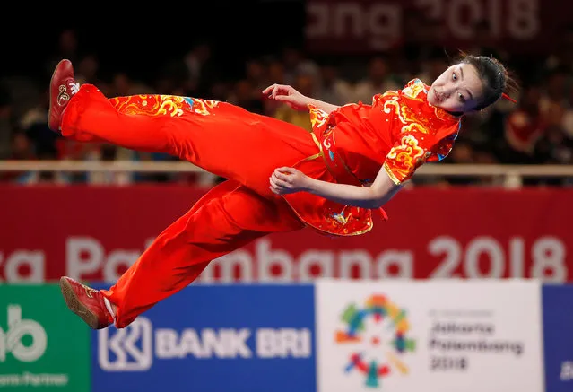 Qi Xinyi of China competes in the changquan event at the women' s wushu competition during the 2018 Asian Games in Jakarta on August 22, 2018. (Photo by Issei Kato/Reuters)