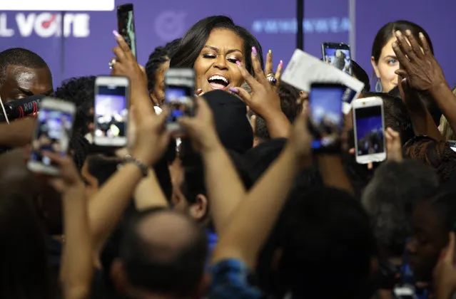 Former first lady Michelle Obama meets with people at a rally to encourage voter registration, Sunday, September 23, 2018, in Las Vegas. (Photo by John Locher/AP Photo)