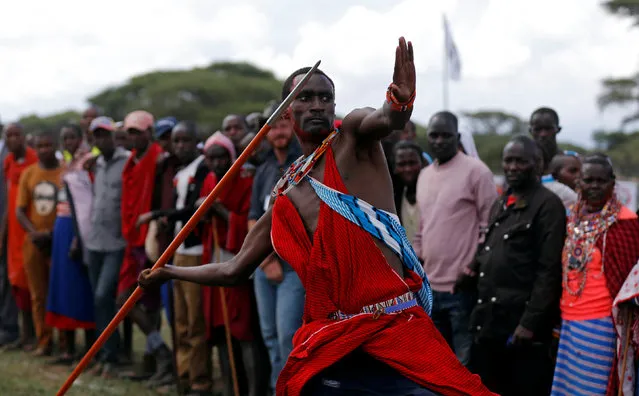 Tipape Lekatoo, a Maasai moran from Mbirikani Manyatta, throws a javelin as he competes in the 2016 Maasai Olympics at the Sidai Oleng Wildlife Sanctuary, at the base of Mt. Kilimanjaro, near the Kenya-Tanzania border in Kimana, Kajiado, Kenya December 10, 2016. (Photo by Thomas Mukoya/Reuters)