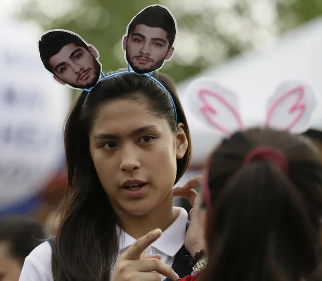 A Filipino fan lines up for the One Direction concert Saturday, March 21, 2015 in the suburban Pasay city south of Manila, Philippines. (Photo by Bullit Marquez/AP Photo)
