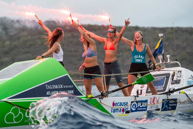 Team RowlikeaGirl, Lauren Morton, Bella Collins, Olivia Bolesworth and Georgina Purdy celebrate as they arrive at English Harbour to complete the Talisker Whisky Atlantic Challenge in Antigua, Caribbean on January 29, 2016. (Photo by Ben Duffy/PA Wire)