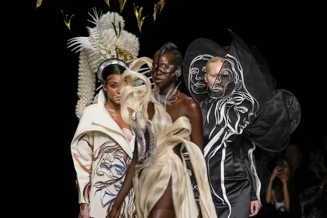Canadian fashion model Winnie Harlow, from left, and models wear creations as part of Iris van Herpen Haute Couture Fall/Winter 2022-2023 fashion collection presented Monday, July 4, 2022 in Paris. (Photo by Michel Euler/AP Photo)