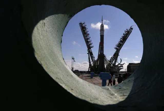 Russia's Soyuz-FG booster rocket with the space capsule Soyuz TMA-16M that will carry a new crew to the International Space Station (ISS) is photographed at the launch pad in Russian leased Baikonur cosmodrome, Kazakhstan, Wednesday, March 25, 2015. (Photo by Dmitry Lovetsky/AP Photo)