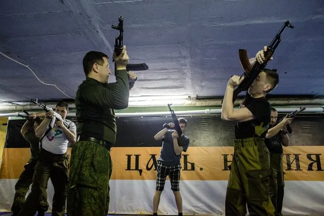 The PARTISAN course participants train with models of the Kalashnikov assault rifle in the sport military-patriotic club REZERV in St. Petersburg, Russia on November 21, 2016. (Photo by Alexander Aksakov/The Washington Post)