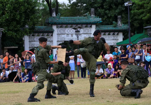 Russian Marines, who are stationed onboard the anti-submarine vessel Admiral Tributs, show their individual combat skills during a public demonstration of capabilities at Luneta National Park in Metro Manila, Philippines January 5, 2017. (Photo by Romeo Ranoco/Reuters)