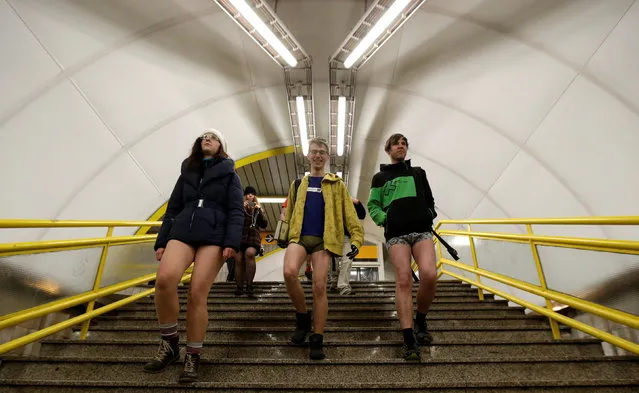 Passengers not wearing pants walk down the stairs during the “No Pants Subway Ride” in Prague, Czech Republic, January 8, 2017. (Photo by David W. Cerny/Reuters)