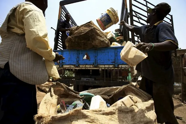 Men load a truck with different types of plastic materials after bringing them to a recycling station in Khartoum North April 16, 2015. (Photo by Mohamed Nureldin Abdallah/Reuters)