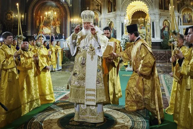 In this photo released by Russian Orthodox Church Press Service, Russian Orthodox Patriarch Kirill, center, delivers the Christmas service in the Christ the Saviour Cathedral in Moscow, Russia, on Saturday, January 6, 2024. While much of the world has Christmas in the rearview mirror by now, people in some Eastern Orthodox traditions celebrate the holy day on Sunday, Jan. 7.  (Photo by Oleg Varov, Russian Orthodox Church Press Service via AP Photo)