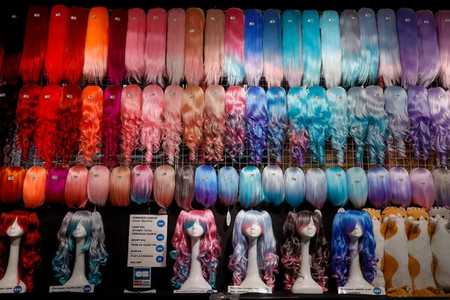 Wigs are on display during the Made in Asia trade fair at Brussels Expo, in Brussels, Belgium, 08 October 2021. The fair dedicated to Asian culture offers displays of food, video games, costumes, cosplay, among others, and runs from 08 to 10 October 2021. (Photo by Stephanie Lecocq/EPA/EFE)