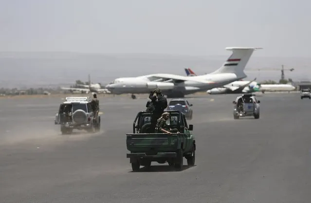 Houthi militants ride on a patrol truck at the international airport of Yemen's capital Sanaa, April 29, 2015. (Photo by Khaled Abdullah/Reuters)