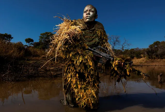 Environment, singles winner: Akashinga – the Brave Ones, by Brent Stirton. Petronella Chigumbura, 30, a member of an all-female anti-poaching unit called Akashinga, undergoes stealth and concealment training in the Phundundu wildlife park, Zimbabwe. (Photo by Brent Stirton/Getty Images/World Press Photo 2019)