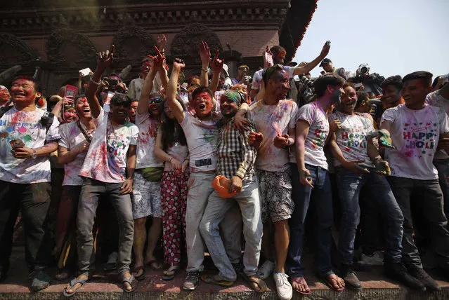 People celebrate Holi, the Festival of Colours, in Kathmandu, Nepal, March 22, 2016. (Photo by Navesh Chitrakar/Reuters)