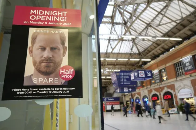 A poster advertises the midnight opening of a store to sell the new book by Prince Harry called “Spare” in London, Monday, January 9, 2023. Prince Harry has defended his memoir that lays bare rifts inside Britain's royal family. He says in TV interviews broadcast Sunday that he wanted to “own my story” after 38 years of “spin and distortion” by others. Harry's soul-baring new memoir, “Spare”, has generated incendiary headlines even before its release. (Photo by Kirsty Wigglesworth/AP Photo)
