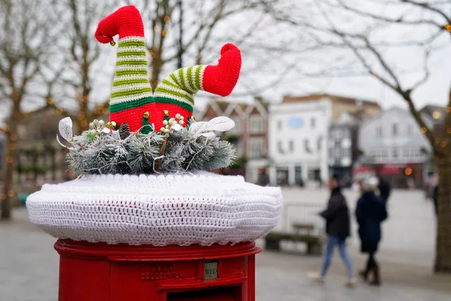 A festive yarn bomb on the top of a Royal Mail post box in Salisbury, Wiltshire in South West England on Wednesday, December 22, 2021. (Photo by Andrew Matthews/PA Images via Getty Images)