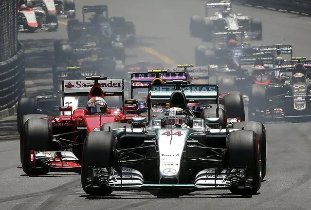 Mercedes Formula One driver Lewis Hamilton of Britain leads the group at the first curve of the first lap during the Monaco Grand Prix in Monaco May 24, 2015. (Photo by Max Rossi/Reuters)