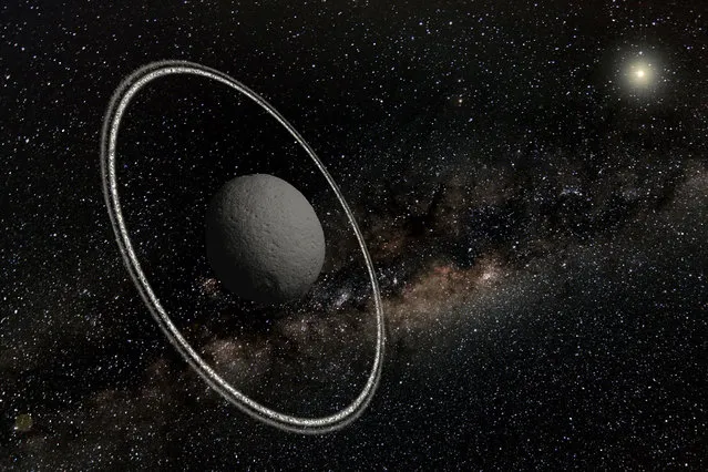 Astonished astronomers have found rings around an asteroid, the smallest object known to have this feature and only the fifth after Jupiter, Saturn, Uranus and Neptune. The twin rings around a rock called Chariklo were spotted in last June as it passed in front of a star, scrutinized by seven telescopes dotted across a stretch of South America. Like Saturn’s rings, Chariklo’s may be composed of water ice. (Photo by Lucie Maquet /AFP Photo/Nature)
