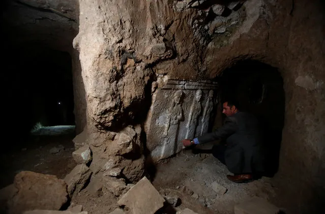 Archaeologist Musab Mohammed Jassim shows artefacts and archaeological pieces in a tunnel network running under the Mosque of Prophet Jonah, Nabi Yunus in Arabic, in eastern Mosul, Iraq March 9, 2017. (Photo by Suhaib Salem/Reuters)