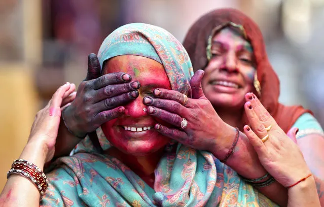 Women take part in Holi, the festival of colours, in Delhi, March 13, 2017. (Photo by Cathal McNaughton/Reuters)