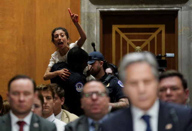 A pro-Palestinian protester being carried off by police shouts at U.S. Secretary of State Antony Blinken as he testifies before a Senate Foreign Relations Committee hearing on President Biden's proposed budget request for the Department of State, on Capitol Hill in Washington on May 21, 2024. (Photo by Kevin Lamarque/Reuters)