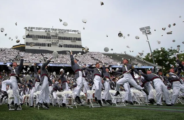 Graduating seniors toss their hats in celebration at the conclusion of graduation ceremonies for the class of 2021 at the United States Military Academy (USMA) West Point, in Michie Stadium in West Point, New York, U.S., May 22, 2021. (Photo by Mike Segar/Reuters)