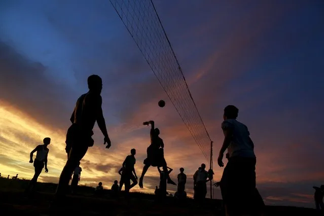 Rohingya Muslims play volleyball near a refugee camp outside Sittwe in Rakhine state May 19, 2015. (Photo by Soe Zeya Tun/Reuters)