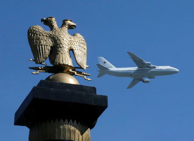 Russian An-124-100 Ruslan strategic heavy transport aircraft flies during the Victory Day parade, marking the 71st anniversary of the victory over Nazi Germany in World War Two, above the two-headed eagle statue at Alexandrovsky Garden in Moscow, Russia, May 9, 2016. (Photo by Maxim Shemetov/Reuters)