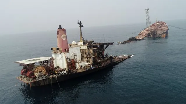 Wreckage of the Trinity Spirit floating production, storage and offloading (FPSO) vessel is seen after an explosion and fire broke out at Shebah Exploration & Production Company Ltd (SEPCOL) offshore production facility on Wednesday, in Warri, Nigeria on February 4, 2022. (Photo by Tife Owolabi/Reuters)