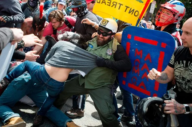 Multiple fights break out between Trump supporters and anti- Trump protesters in Berkeley, California on April 15, 2017. (Photo by Josh Edelson/AFP Photo)
