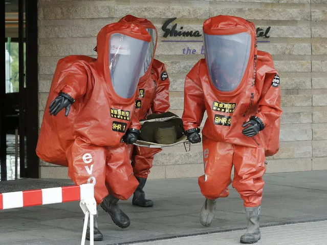 Tokyo Fire Department special rescue unit members wearing special anti-NBC (Nuclear, Biological, and Chemical weapons) suits during an anti-terrorism drill in preparation for the upcoming Group of Seven Ise-Shima Summit at Shima Kanko hotel in Shima, Mie Prefecture, central Japan, 11 May 2016. The G7 summit will be held in Shima on 26 and 27 May 2016. (Photo by Kimimasa Mayama/EPA)