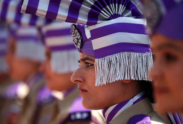 Indian policewomen in ceremonial uniforms wait to present an honour guard to Jammu and Kashmir Chief Minister Mehbooba Mufti (unseen) outside the civil secretariat complex on the first day of the Darbar Move in Srinagar, May 9, 2016. (Photo by Danish Ismail/Reuters)
