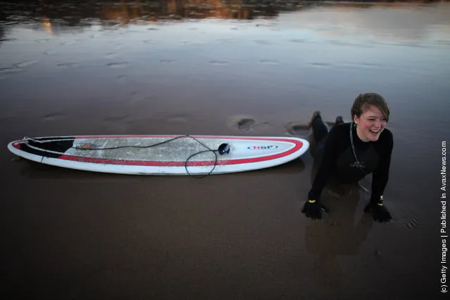 Surfers Brave The Cold To Enjoy Year Round Surfing