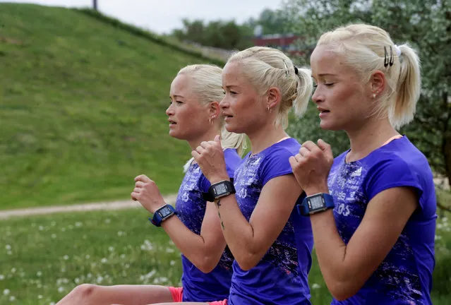 Estonia's olympic team female marathon runners triplets (L-R) Lily, Liina and Leila Luik run during a training session in Tartu, Estonia, May 26, 2016. (Photo by Ints Kalnins/Reuters)