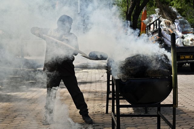 The police burn 1.2 tonnes of seized marijuana and 226 kilograms of methamphetamine at the regional police headquarters in Banda Aceh on August 6, 2024. (Photo by Chaideer Mahyuddin/AFP Photo)