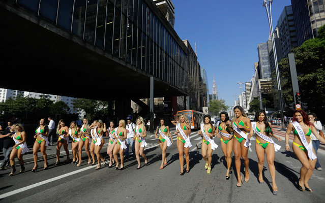 Miss BumBum Brazil contestants walk in the middle of Paulista Avenue to promote their beauty contest in the financial district of Sao Paulo, Brazil, Monday, August 3, 2015. (Photo by Nelson Antoine/Frame/Estadão Conteúdo)