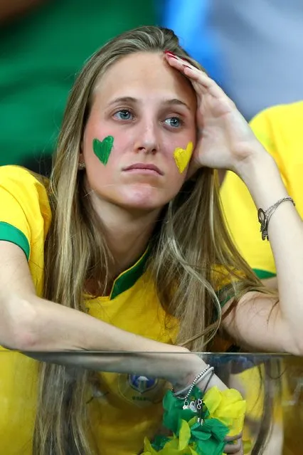 A Brazil fan looks dejected during the 2014 FIFA World Cup Brazil Semi Final match between Brazil and Germany at Estadio Mineirao on July 8, 2014 in Belo Horizonte, Brazil. (Photo by Martin Rose/Getty Images)