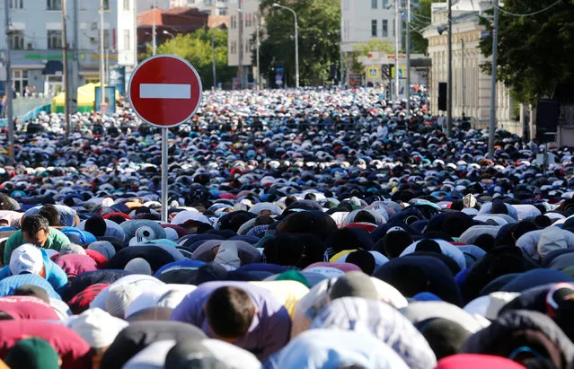 Muslims attend a morning prayer to celebrate Eid al-Fitr, marking the end of the holy month of Ramadan, in Moscow, Russia, July 5, 2016. (Photo by Maxim Zmeyev/Reuters)