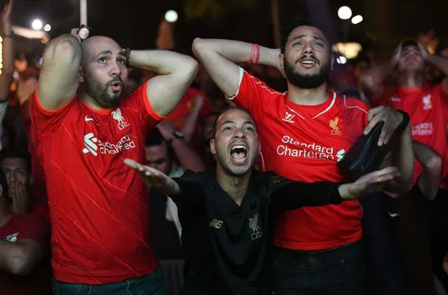 Egyptian fans of Liverpool react while watching the UEFA Champions League final football match between Liverpool and Real Madrid at a caf in the capital Cairo on May 28, 2022. Real Madrid won 1-0. (Photo by Ahmed Hasan/AFP Photo)