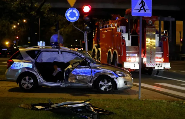 A police car, which is part of the motorcade transporting NATO General Secretary Jens Stoltenberg's delegation, is seen after an accident with a truck in Warsaw, Poland on August 24, 2017. (Photo by Kacper Pempel/Reuters)