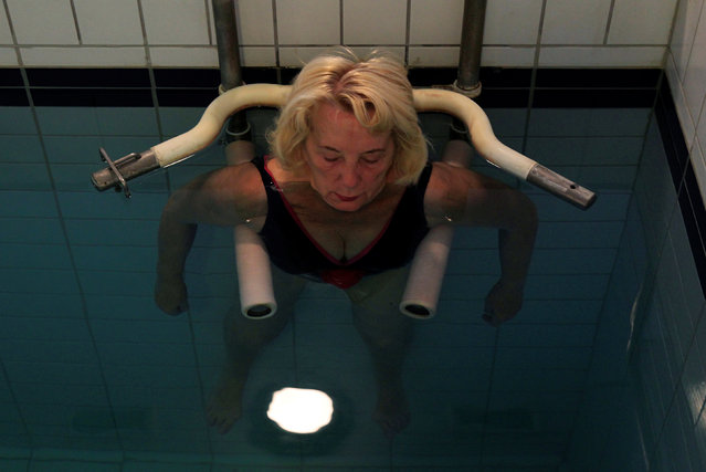 A woman relaxes at the Lukacs Bath in Budapest, Hungary July 6, 2016. (Photo by Bernadett Szabo/Reuters)