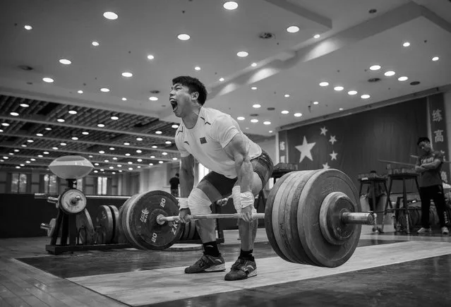 Chinese weightlifter Chen Lijun, who competes in the 62 kg weightclass, lifts during a training session in preparation for the Rio Olympics at the Training Center of General Administration of Sports in China on July 15, 2016 in Beijing, China. Lijun won the World Championships in 2013 and 2015 and is a world record holder. (Photo by Kevin Frayer/Getty Images)