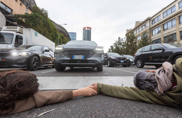 Last Generation activists block traffic in Milan, Italy on October 16, 2023. (Photo by Stefano Porta/LaPresse/Rex Features/Shutterstock)