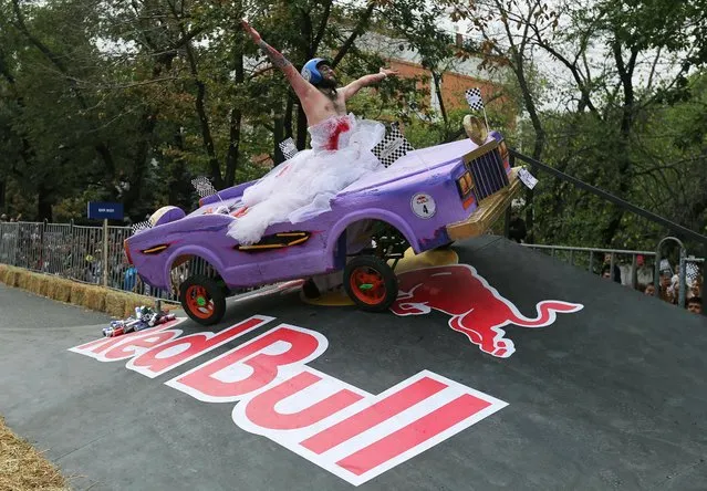 A competitor drives his homemade vehicle without an engine during the Red Bull Soapbox Race in Almaty, Kazakhstan on September 11, 2022. (Photo by Pavel Mikheyev/Reuters)