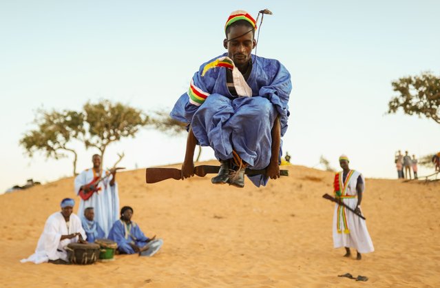 Mauritanian dancers in traditional costumes, are viewed in Lompoul desert, 180 km away from the capital city Dakar, Senegal on December 31, 2023. Mauritanian dancers and music groups, who organize shows for tourists in the Lompoul Desert, are the center of attention with their dances and cultural shows specific to West Africa. Dancers wearing traditional clothes perform dances reflecting the desert nomadic culture. (Photo by Cem Ozdel/Anadolu via Getty Images)