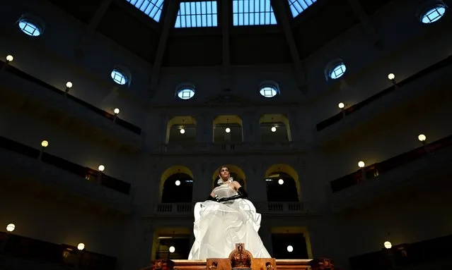 A model takes to the runway during the Fashion x Art experience as part of Melbourne Fashion Week at State Library Victoria in Melbourne on Monday, October 10, 2022. (Photo by Joel Carrett/AAP Image)