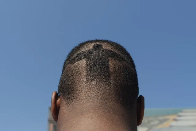 Kenzo Hartless rocks a Cristo Redentor shave in his hair outside of Olympic Park on Wednesday, August 17, 2016. (Photo by Aaron Ontiveroz/The Denver Post)