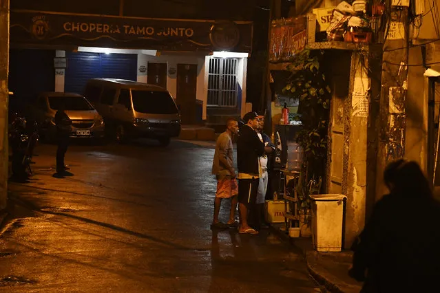 People watch from the streets into bars and restaurants as they watch the action during the men's gold medal soccer match between Brazil and Germany during Rio 2016 on Saturday, August 20, 2016. (Photo by Aaron Ontiveroz/The Denver Post)