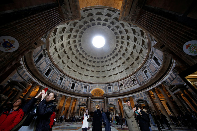 Tourists visit the ancient Pantheon in downtown Rome, Italy December 11, 2017. (Photo by Tony Gentile/Reuters)