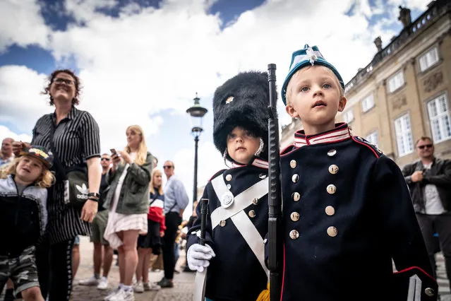 The 9-year old twin Malthe and William patrols around Amalienborg in Copenhagen, Denmakr, 21 July 2020. The twin likes to dress as the Danish Queen Margrethe's Royal Life Guards amusing visiting tourists and locals. (Photo by Mads Claus Rasmussen/EPA/EFE)